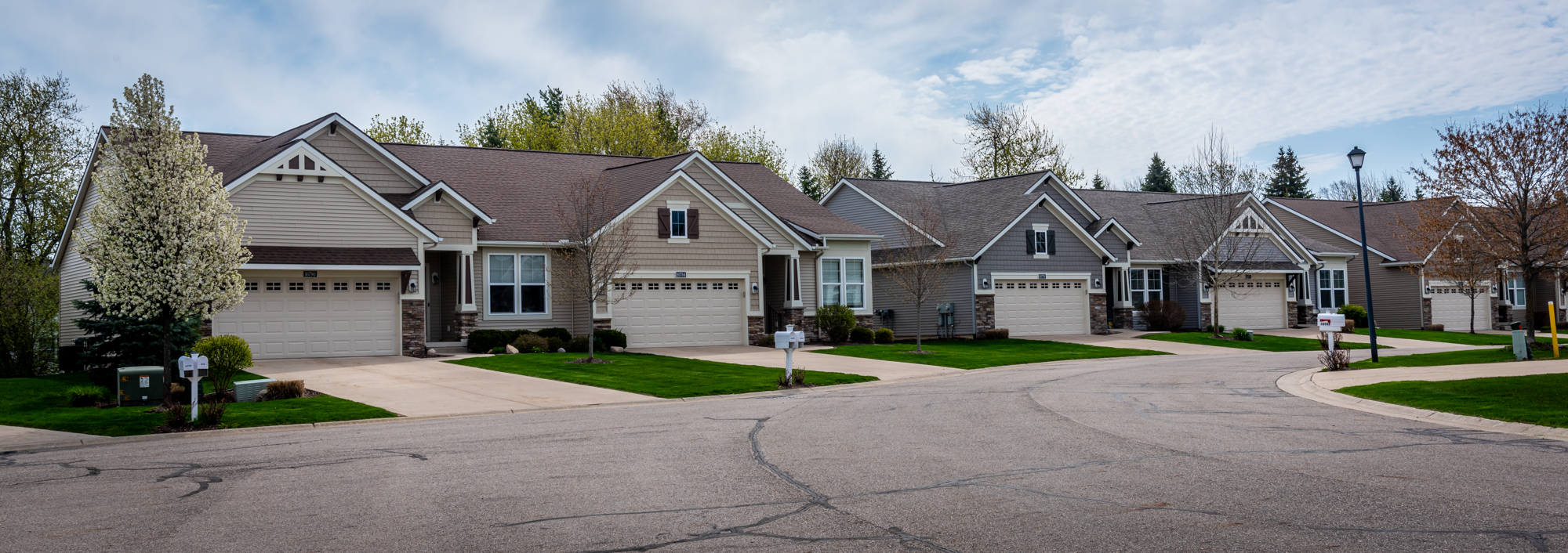 tan and beige houses on a suburban street